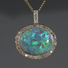 opal and diamond gold pendant surrounded  by diamonds
