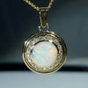 Natural opal swirling magic 10k gold pendant